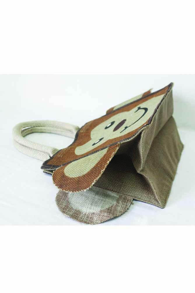 animal print  jute bag with brown monkey printed on it with angle view